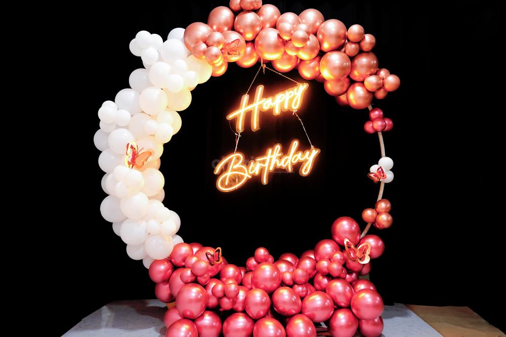 Add a touch of magic to your special day with our stunning rose gold and white balloon backdrop.