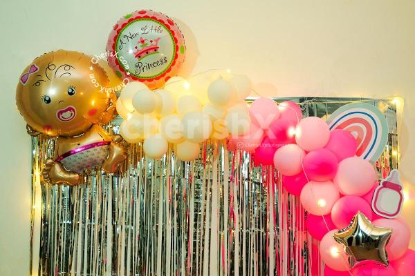 Get this gorgeous Pink balloon decoration for your baby naming ceremony or Annaprashan!