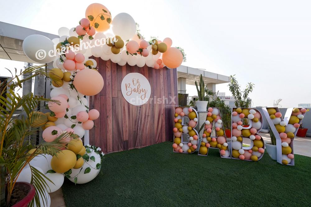 Book a Charming Peach Colored Baby Shower Decor to throw a grand baby shower for the "mother to be"!