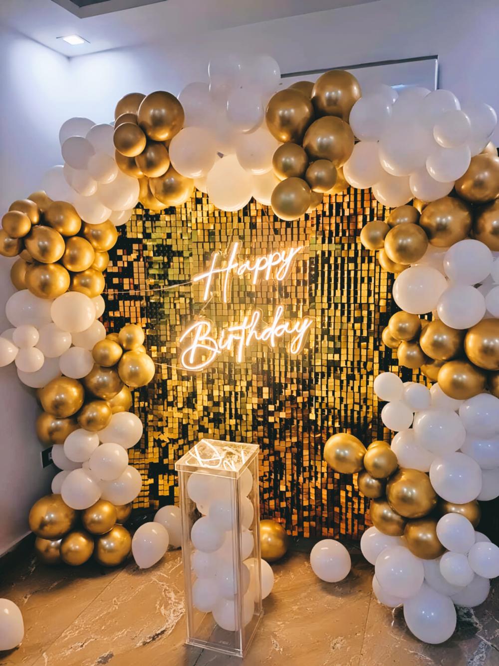 Make a statement with this golden sequin backdrop for your birthday party.