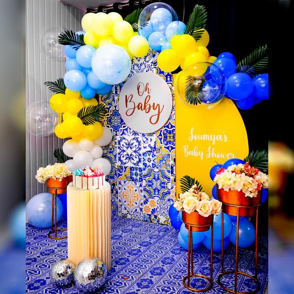 This theme features vibrant sun board cutouts, whimsical balloons, and delicate palm leaves.