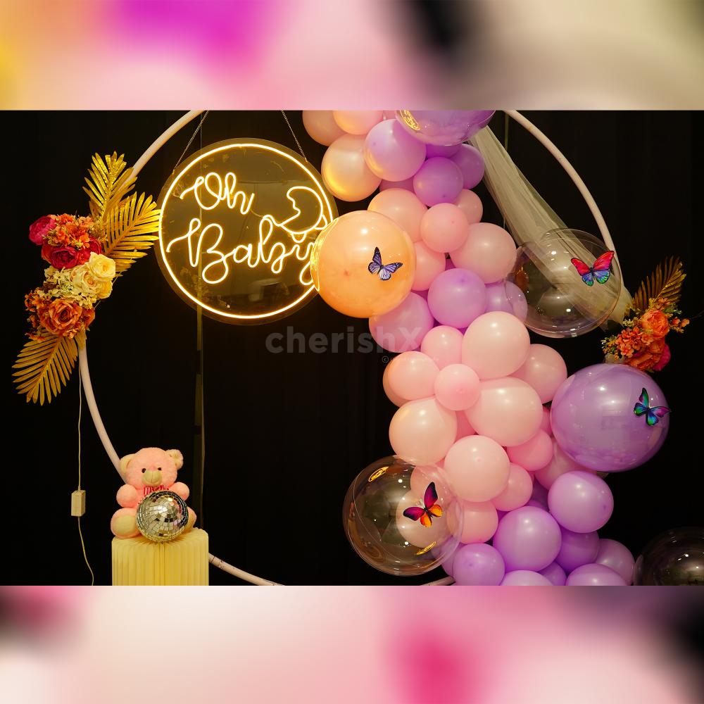 Golden Leaves and balloons embrace Nature's Beauty in Pastel baby shower decorations.