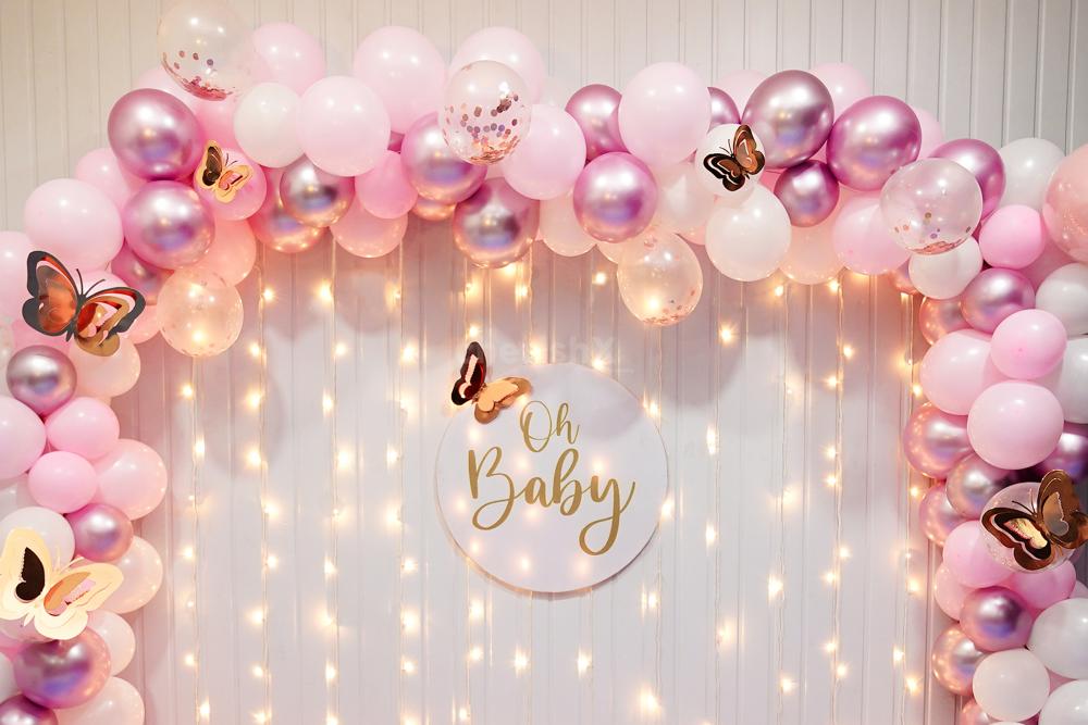 Experience the Charm of Rosy Whispers as Pastel Pink Balloons and Gold Butterflies.