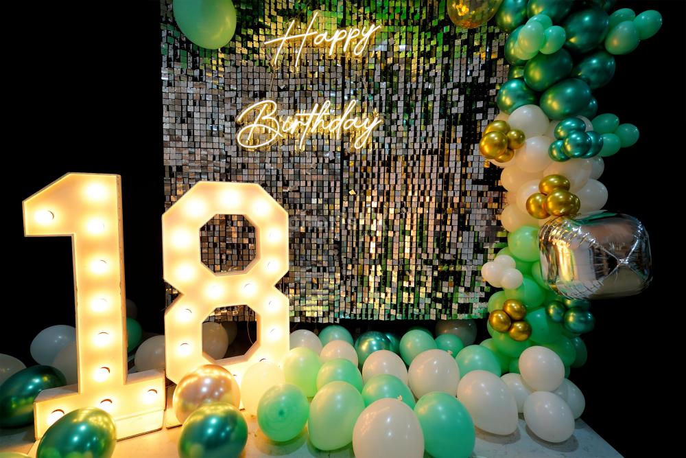 Golden hues and whimsical balloons make for the perfect birthday celebration decor.