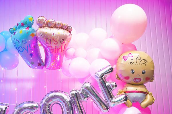 A symphony of pastel hues and shimmering lights welcomes your twins into a world full of love and wonder.