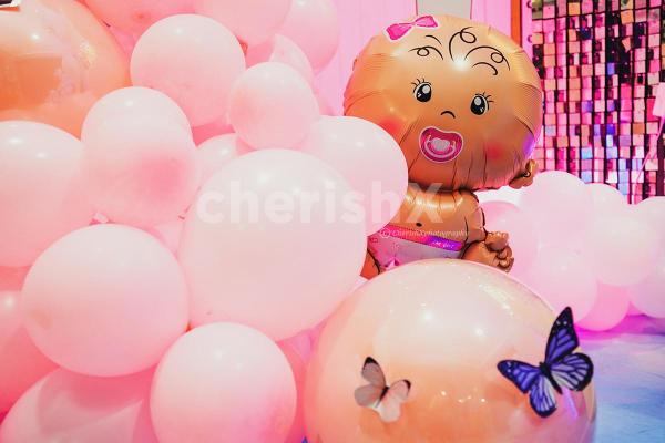 A perfect blend of pastel balloons, twinkling lights, and enchanting decor elements.