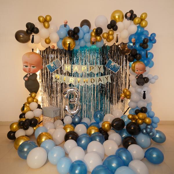 The Boss Baby Themed Decoration includes themed bunting as well as Boss Baby cut-outs.
