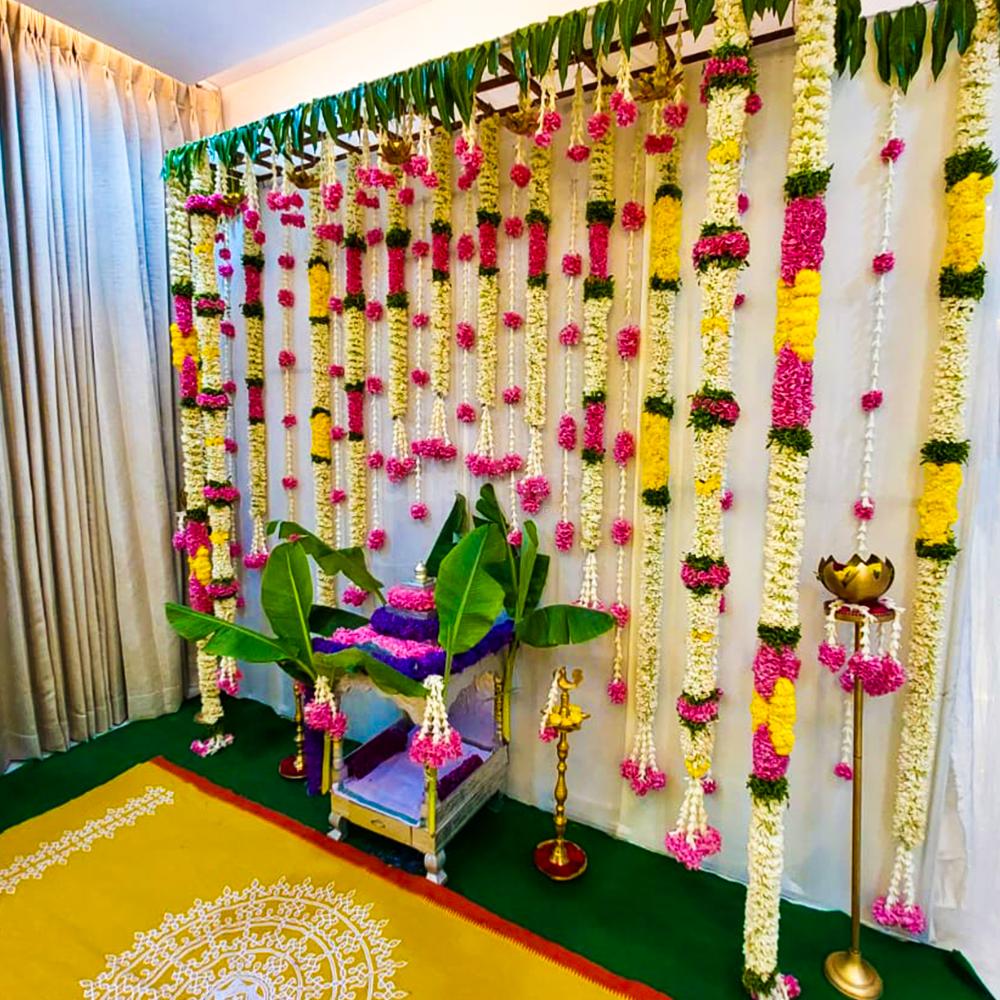 Natural flower garlands with ganeru flower hangings add a touch of tradition
