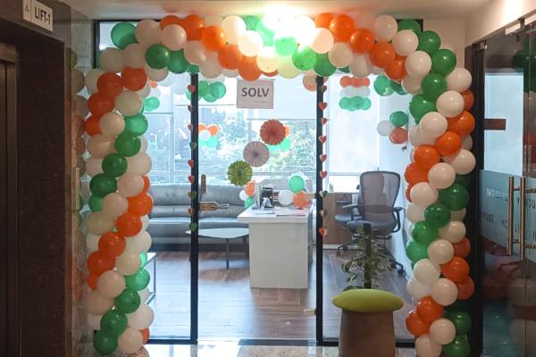 Your office will glow in tri-colour balloons, paper lanterns, and pixel lights.