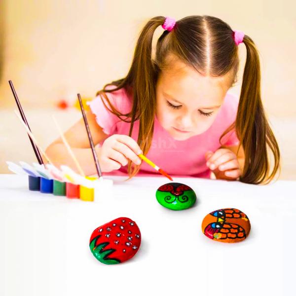 Pebble Stone Painting captivates young hearts with a rainbow of designs, leaving behind memories to treasure.