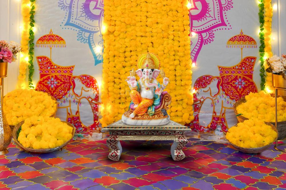 Experience the harmonious fusion of spirituality and aesthetics with our exquisite Ganpati adornments, where vibrant hues and intricate designs converge.