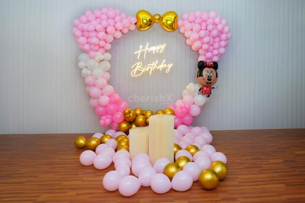 Dive into a world of enchantment with Minnie's Playful Balloon Decorations.
