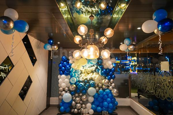 Customize your celebration with a Balloon Wall featuring a personalized neon light message, adding a touch of magic to your special day.