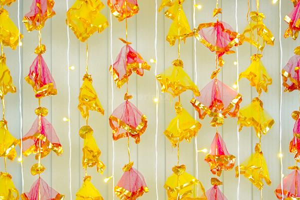 Add a playful touch to your setup with these delightful Tassels, Golden Bell Hangings, Yellow Garlands, and more.