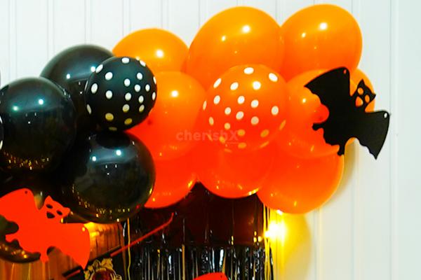 The Whole Eerie Set-Up With Creepy Colored Balloons Creates A Spooky Ambience