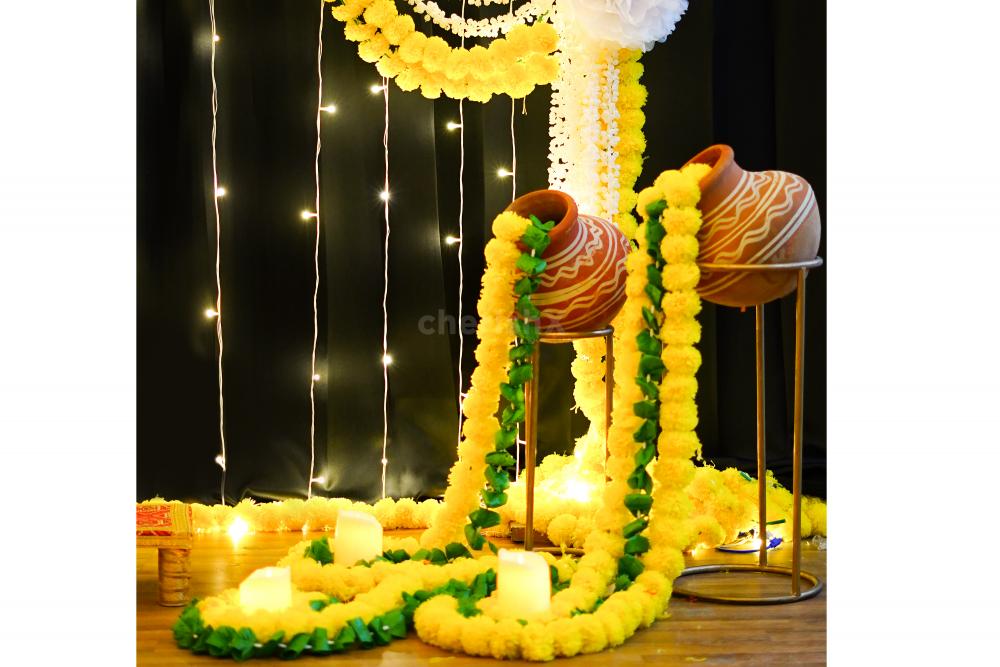 Craft your sacred space with our carefully designed decoration stand adorned with golden bells, fragrant flowers, and charming pom-poms.