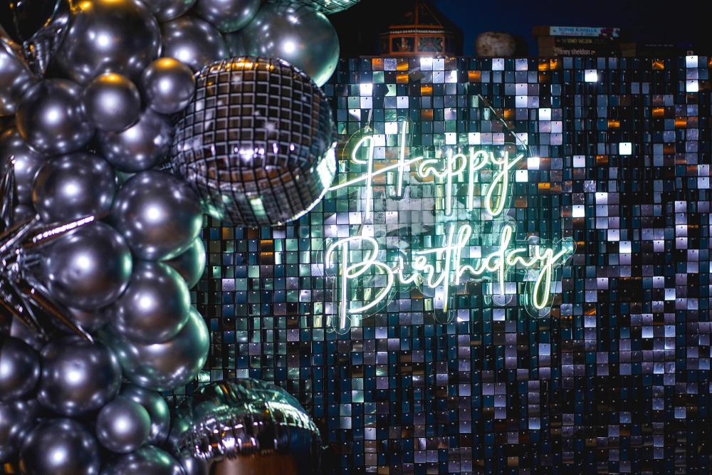 Our Bollywood-inspired decor featuring disco foil balloons and a Happy Birthday Neon Light guarantees a night of starry splendour and unforgettable memories.