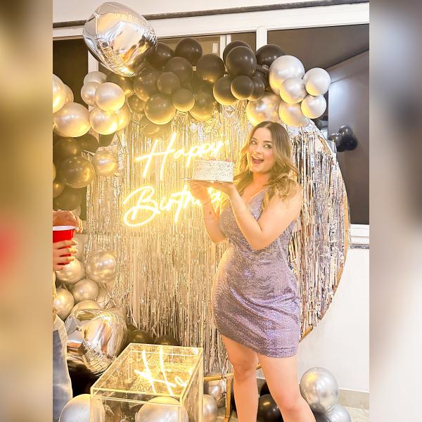 Joyous smiles and shared memories are beautifully framed against the Black and Silver Balloon Backdrop, creating a memorable and stylish birthday experience.
