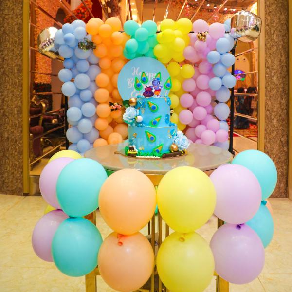 The blend of Blue, Peach, Green, Purple Pastel, and Yellow Balloons come together and make a soothing birthday experience.