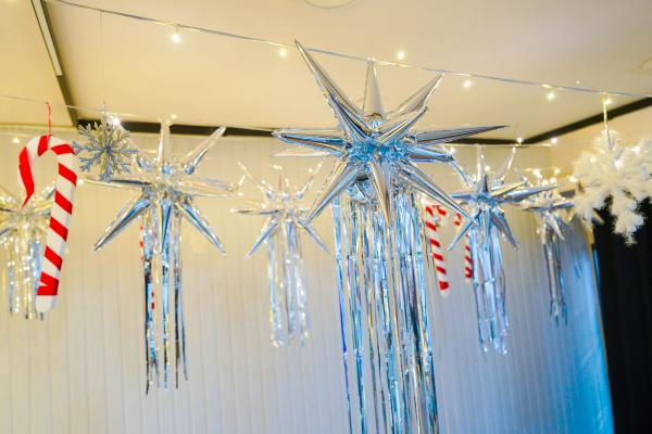 Delicate snowflakes, Candy Cane Sticks, and Silver Glitter Balls suspended in a breathtaking display, adding a unique charm to