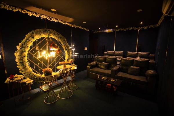 Elevate family celebrations with CherishX's private movie show setup and beautiful ring backdrop.