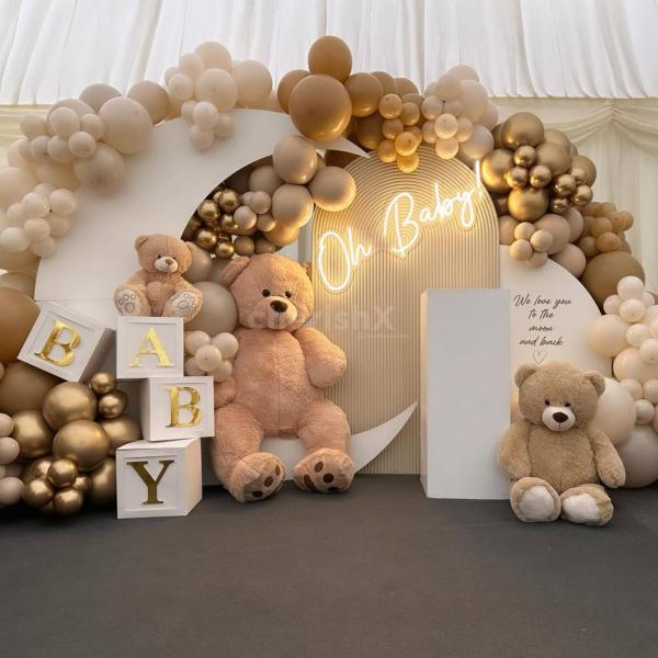 A Teddy Truffle baby shower decor featuring a Sunboard Cutout and Moon Sunboard adorned with Vintage Apricot and Choco Brown Balloons.