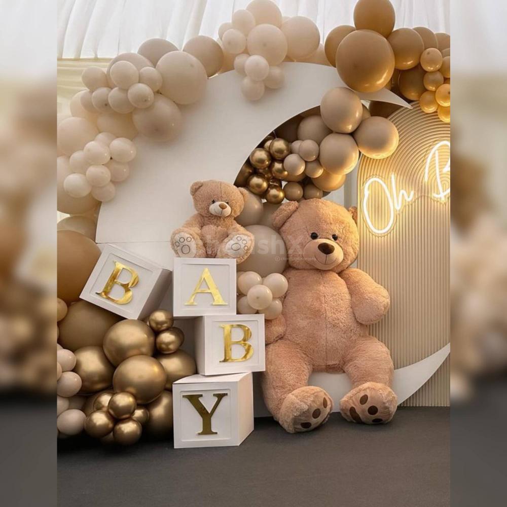 Capture joy in every detail with our exclusive Teddy Truffle theme, showcasing a lavish arrangement with Chrome balloons and an 'OH BABY' Neon Light.