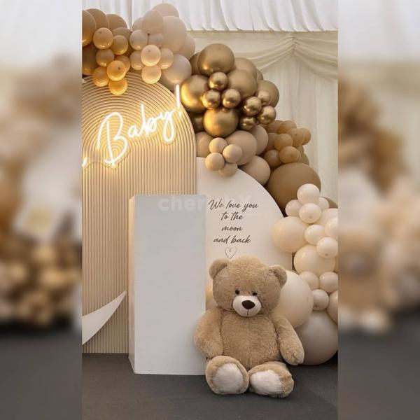 Immerse yourself in refinement with our premium baby shower setup, complete with a white square table, adorable teddy bears, and a charming 4-letter B.A.B.Y box.