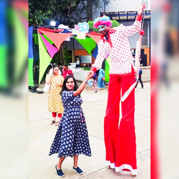 stilt walkers with 11 ft tall performers in charming clown costumes