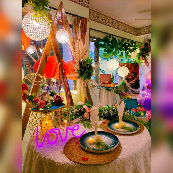 Elegant table setting adorned with sumptuous meals, creating a whimsical and romantic atmosphere at Love Garden, Jaipur.