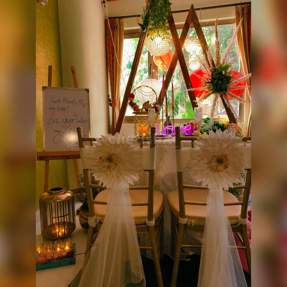 Captivating view of Love Garden's enchanting decor, featuring elegant table arrangements and a warm, intimate atmosphere.
