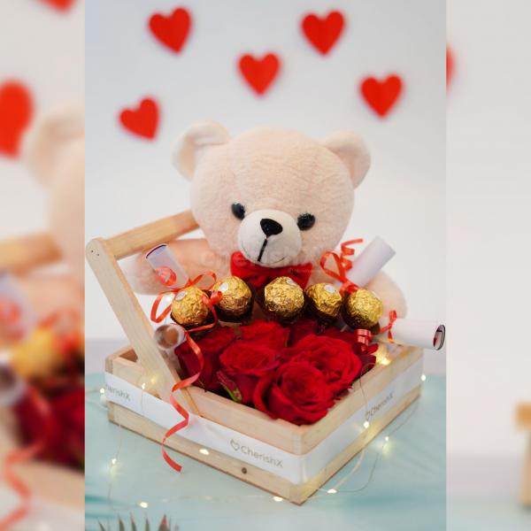 A cuddly teddy bear nestled in the hamper, promising comfort and warmth for your loved one.