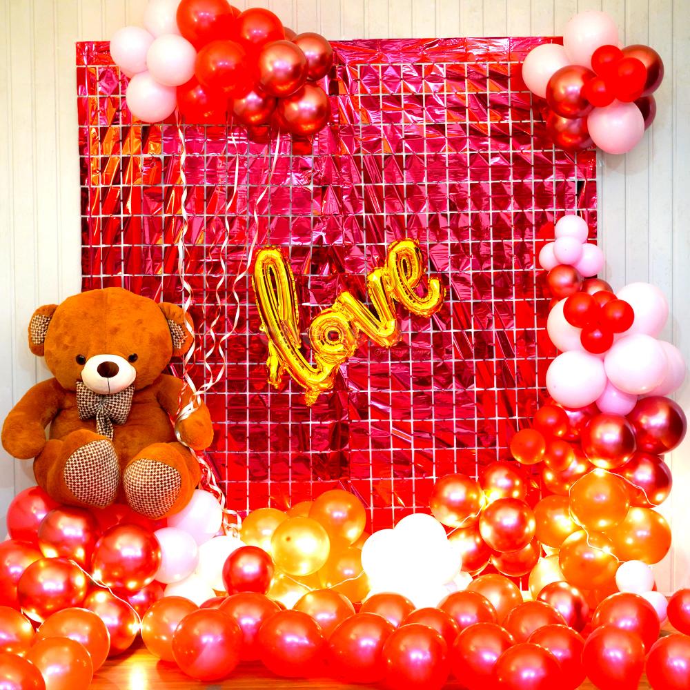 An enchanting Valentine's decor arrangement with a mix of balloons with a warm LED light.