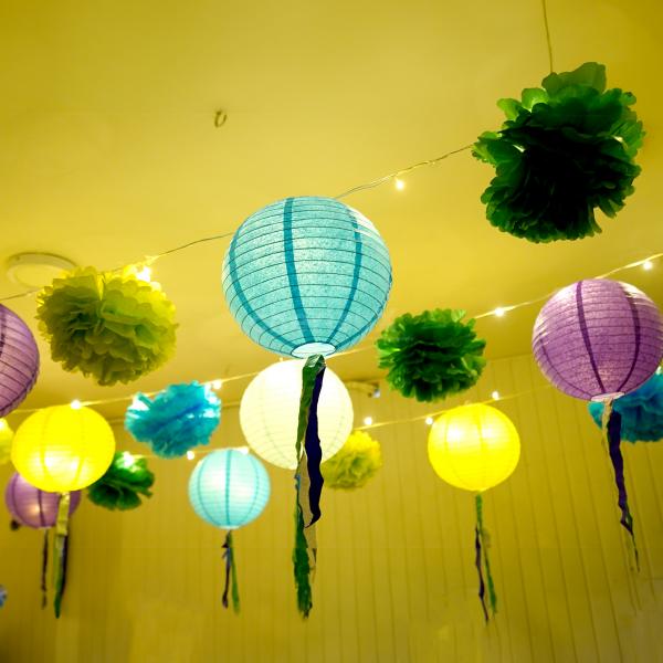 Purple, light blue, light green, and dark blue streamers, add a burst of colour to the decor.