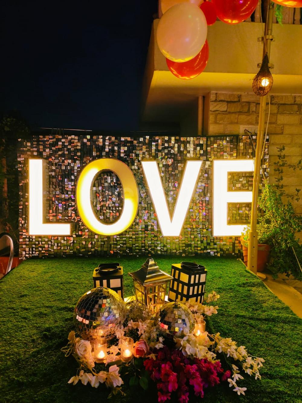 Illuminate your love story with neon declarations under the twilight sky.