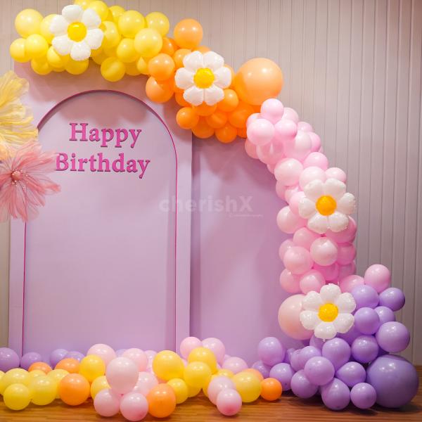 Capturing the essence of celebration with flowers and pastel balloons