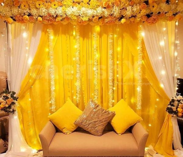 Stunning backdrop decor featuring high-quality artificial flowers and charming hanging props.