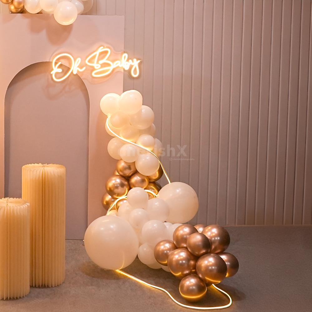 A dreamy baby shower with glowing butterflies and elegant decor