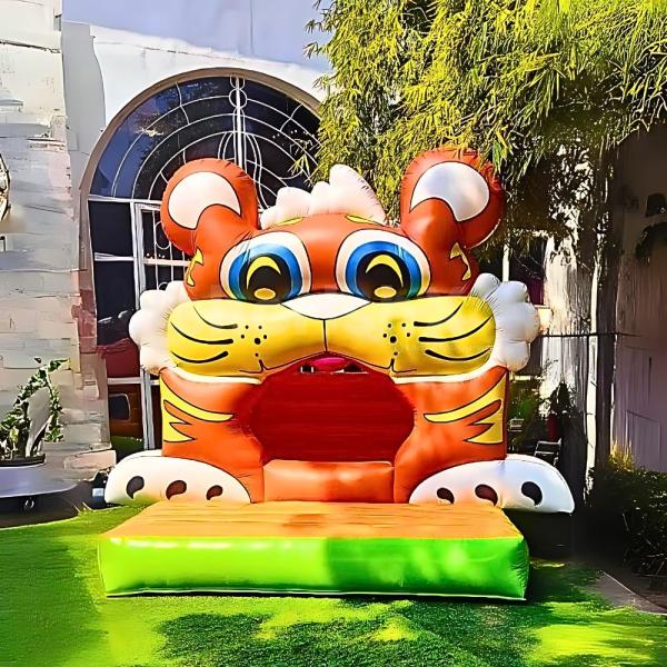 Kids having a roaring good time on the Tiger Theme Bouncy – 12x14 ft of fun